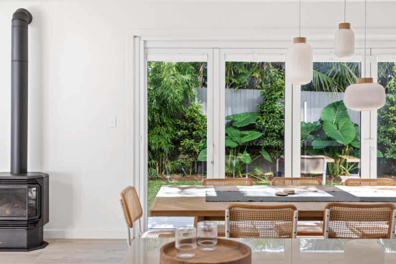 Interior dining room with white uPVC, double glazed bi-fold doors.