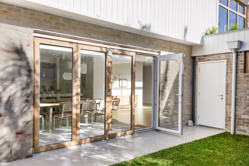 Exterior garden view of bi-fold door in turner oak malt uPVC and double glazing